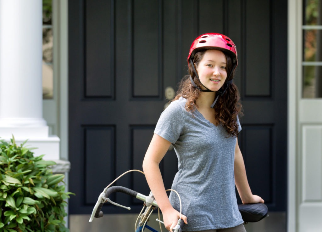 Teen girl with braces and a bicycle